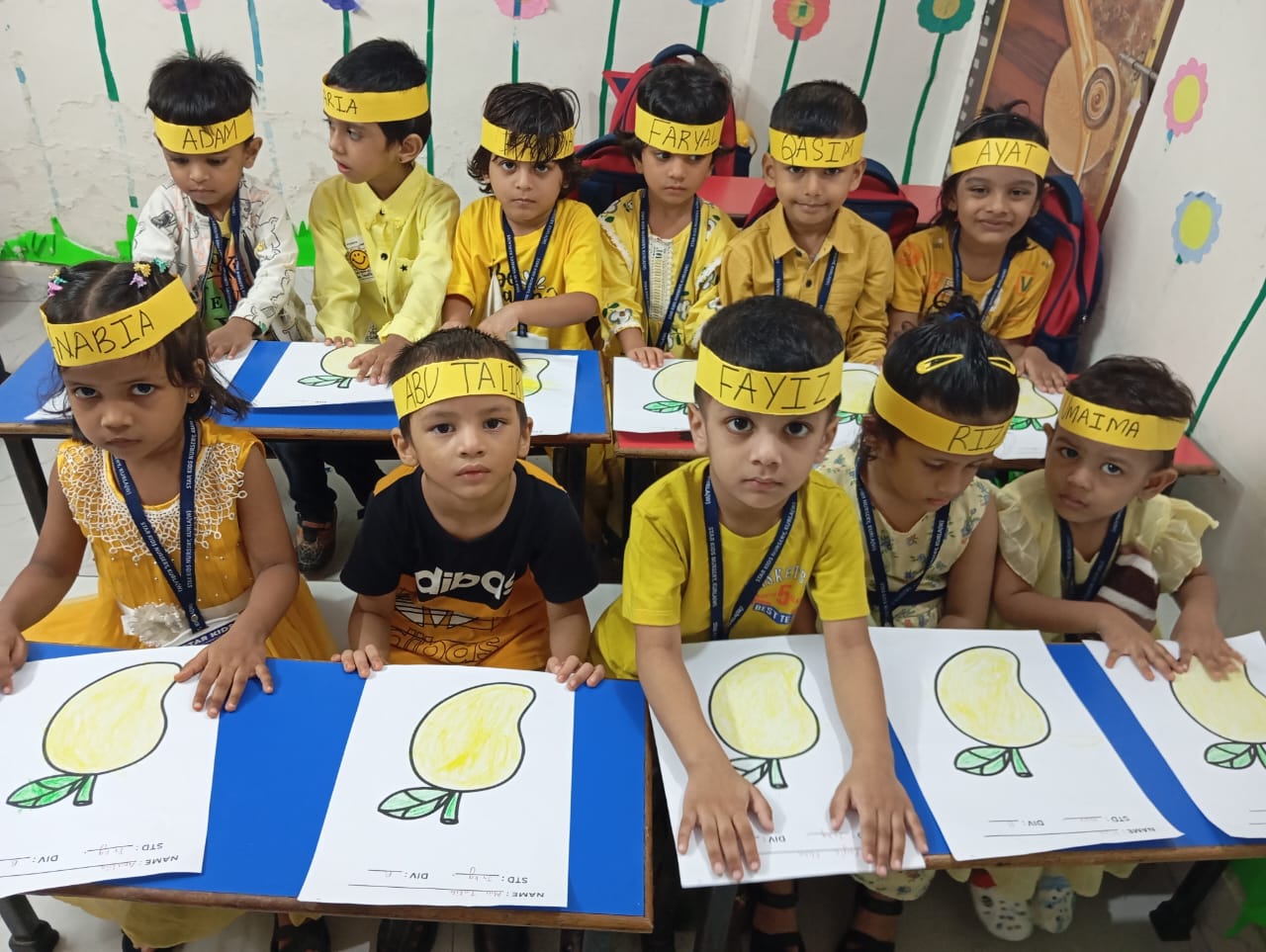 Teacher interacting with happy preschool children